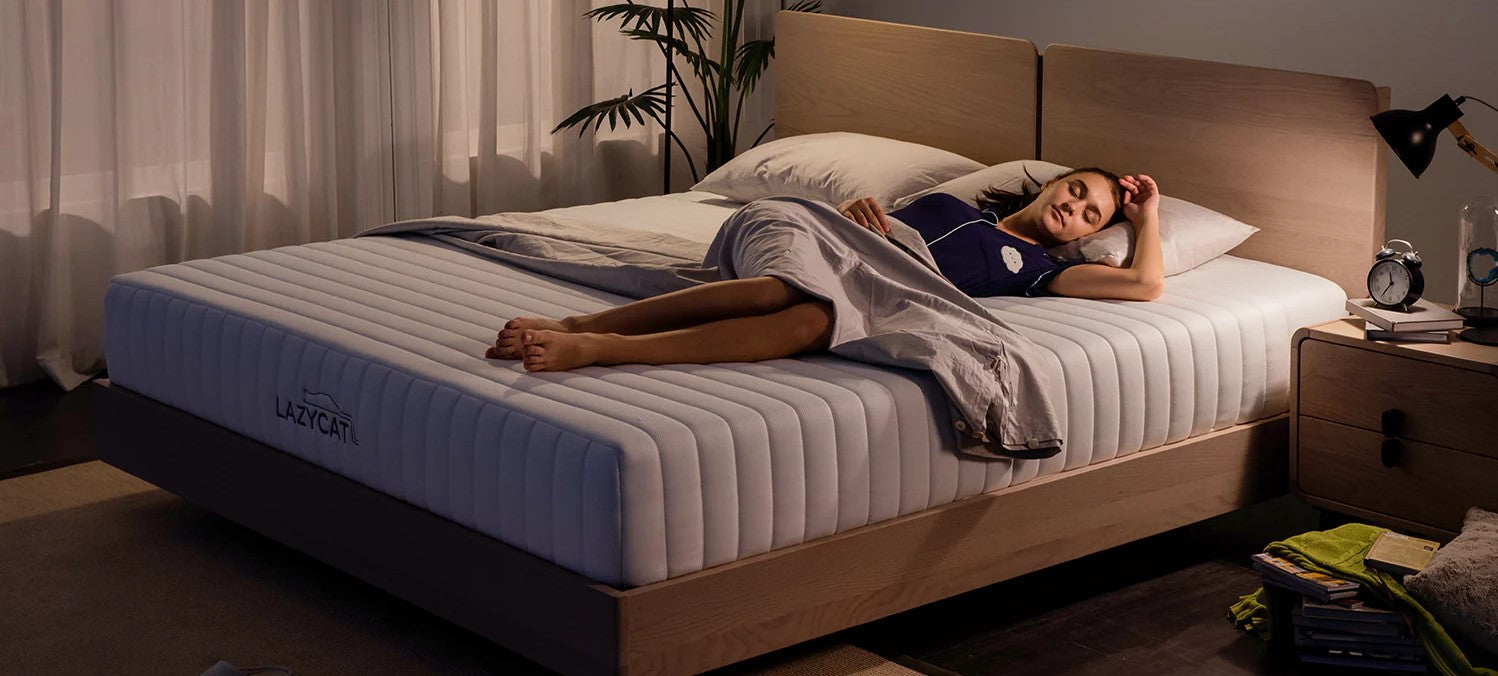 a woman sleeps on her lazycat memory foam mattress