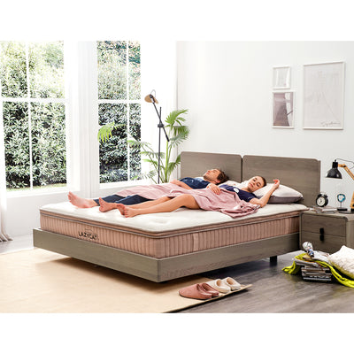 couple sleeps soundly on their medium firm spring mattress