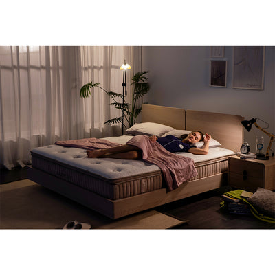 woman sleeps on her newly bought spring mattress